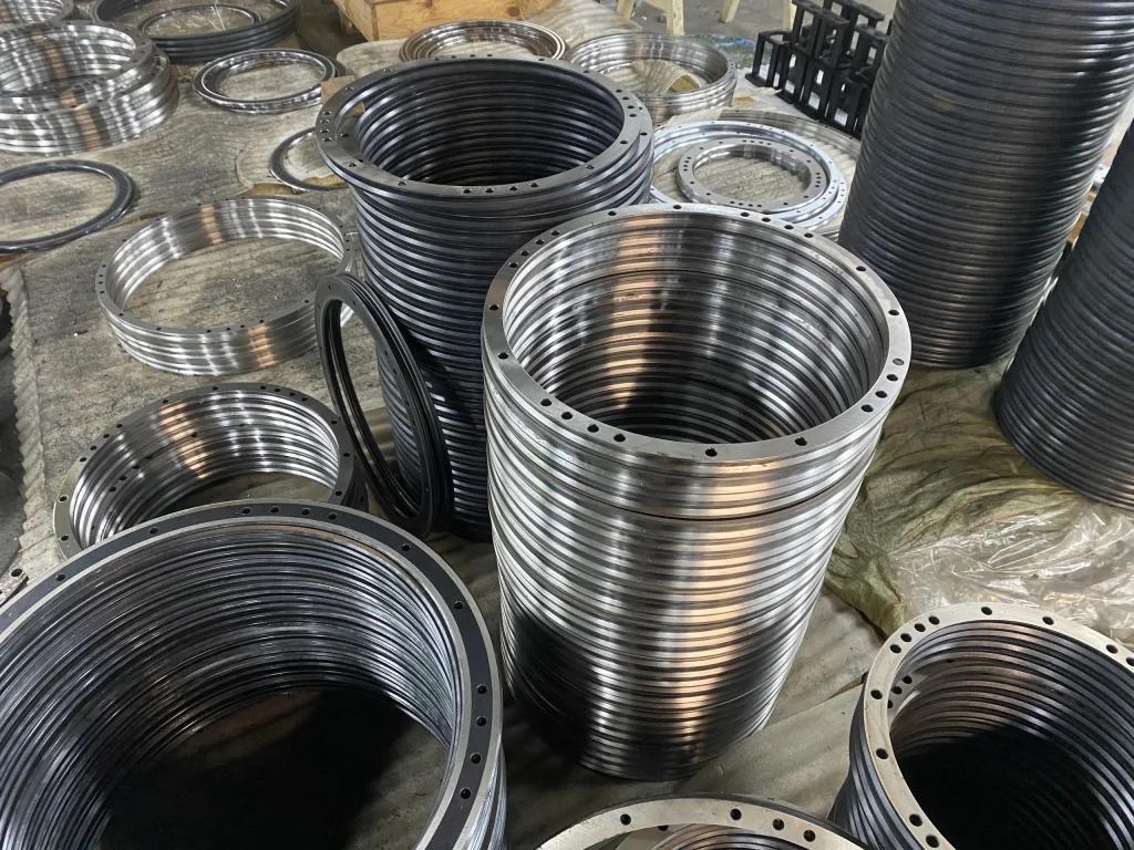 Stacks of circular rail components with different diameters and mounting-hole patterns